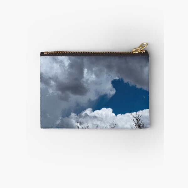 Item preview, Bare treetops silhouetted against massive cumulus clouds with trails designed and sold by lisavonbiela.