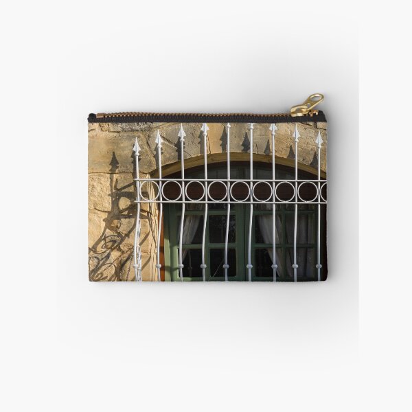 Item preview, Green Arched Window With Decorative White Wrought Iron Bars On Rustic Stone Wall In Sunlight designed and sold by Nmallia.