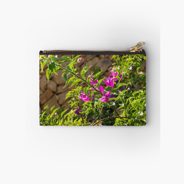 Item preview, Sunlit Pink Bougainvillea Blossoms Against Rustic Stone Wall With Lush Green Leaves Outdoor Garden Branches designed and sold by Nmallia.