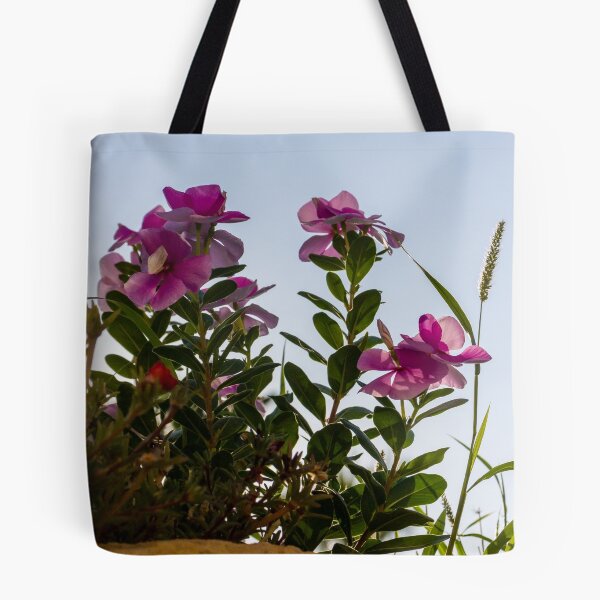 Item preview, Pink Garden Flowers Reaching Toward Blue Sky Over Stone Wall in Warm Sunlight designed and sold by Nmallia.