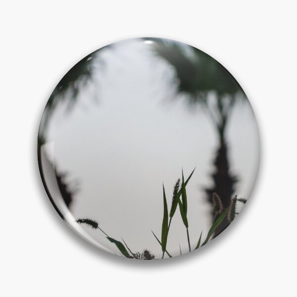 Item preview, Silhouetted Coastal Grasses With Blurred Palm Trees At Dusk Sky, Tropical Sunset Mood designed and sold by Nmallia.