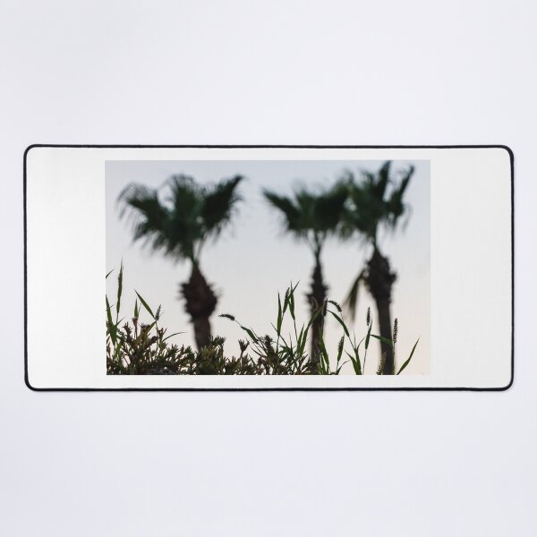 Item preview, Silhouetted Coastal Grasses With Blurred Palm Trees At Dusk Sky, Tropical Sunset Mood designed and sold by Nmallia.