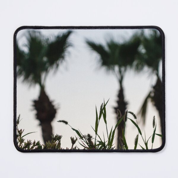 Item preview, Silhouetted Coastal Grasses With Blurred Palm Trees At Dusk Sky, Tropical Sunset Mood designed and sold by Nmallia.