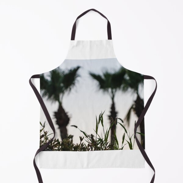 Item preview, Silhouetted Coastal Grasses With Blurred Palm Trees At Dusk Sky, Tropical Sunset Mood designed and sold by Nmallia.