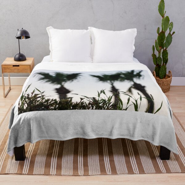 Item preview, Silhouetted Coastal Grasses With Blurred Palm Trees At Dusk Sky, Tropical Sunset Mood designed and sold by Nmallia.