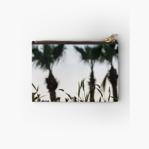 Item preview, Silhouetted Coastal Grasses With Blurred Palm Trees At Dusk Sky, Tropical Sunset Mood designed and sold by Nmallia.