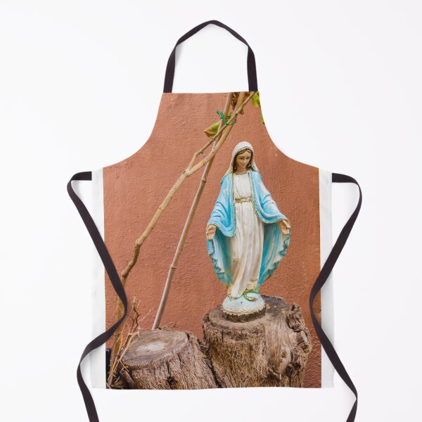 Item preview, Statue Of The Virgin Mary In Blue Robe Standing On Tree Stump Against Terracotta Wall designed and sold by Nmallia.