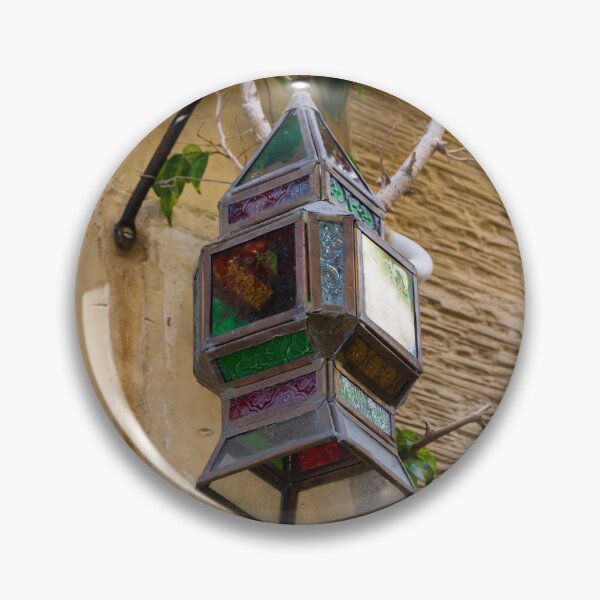Item preview, Colorful Vintage Stained Glass Lantern Hanging On Rustic Wall With Green Vines In Alley designed and sold by Nmallia.