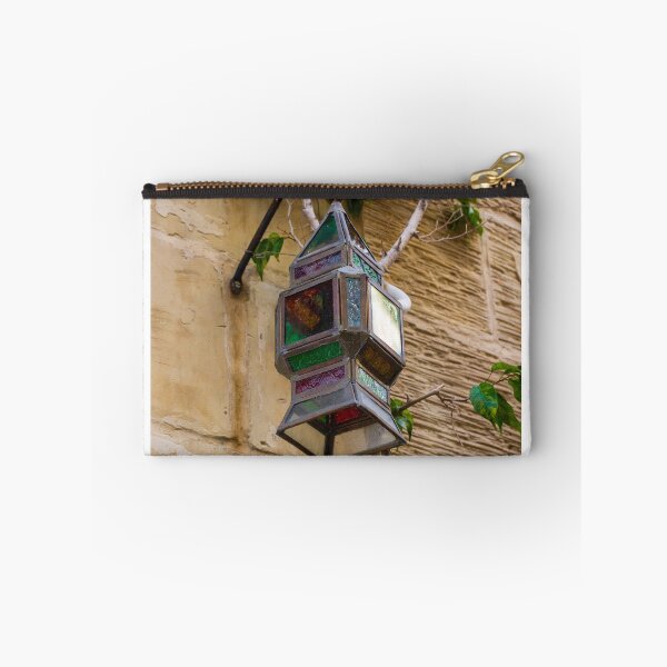 Item preview, Colorful Vintage Stained Glass Lantern Hanging On Rustic Wall With Green Vines In Alley designed and sold by Nmallia.