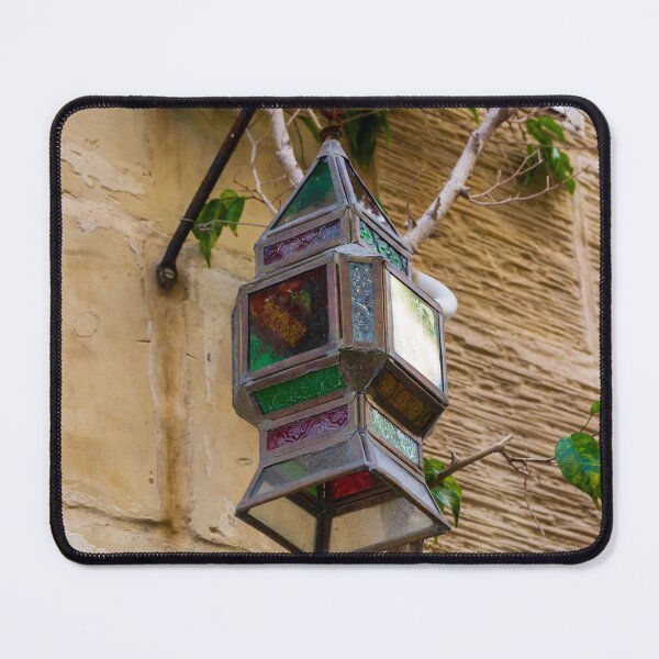 Item preview, Colorful Vintage Stained Glass Lantern Hanging On Rustic Wall With Green Vines In Alley designed and sold by Nmallia.