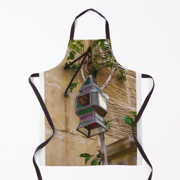 Item preview, Colorful Vintage Stained Glass Lantern Hanging On Rustic Wall With Green Vines In Alley designed and sold by Nmallia.