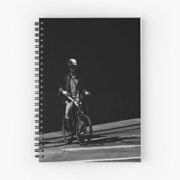 Item preview, Chiaroscuro Cyclist: Dramatic Black and White Street Photography designed and sold by Letalprema.