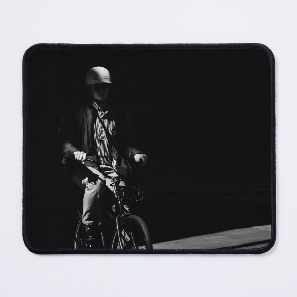 Item preview, Chiaroscuro Cyclist: Dramatic Black and White Street Photography designed and sold by Letalprema.