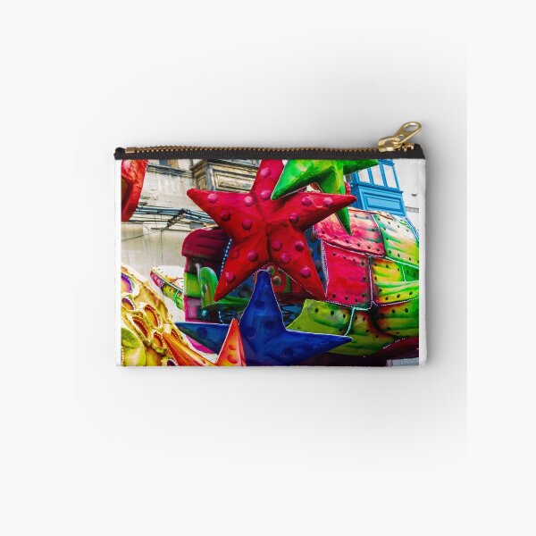 Item preview, Colorful Star Decorations On A Carnival Float During A Street Festival Parade In Historic Town designed and sold by Nmallia.