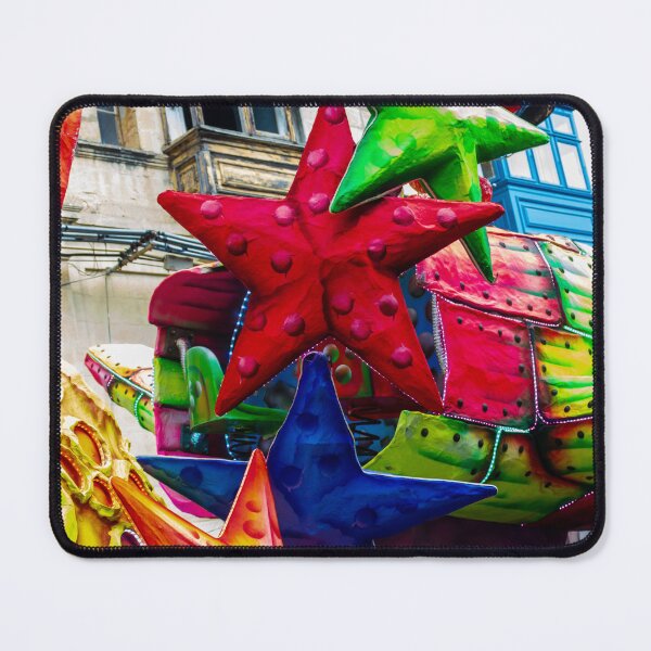 Item preview, Colorful Star Decorations On A Carnival Float During A Street Festival Parade In Historic Town designed and sold by Nmallia.