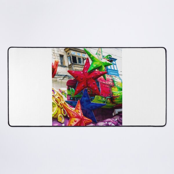 Item preview, Colorful Star Decorations On A Carnival Float During A Street Festival Parade In Historic Town designed and sold by Nmallia.