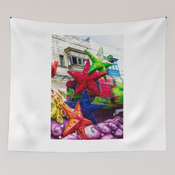 Item preview, Colorful Star Decorations On A Carnival Float During A Street Festival Parade In Historic Town designed and sold by Nmallia.