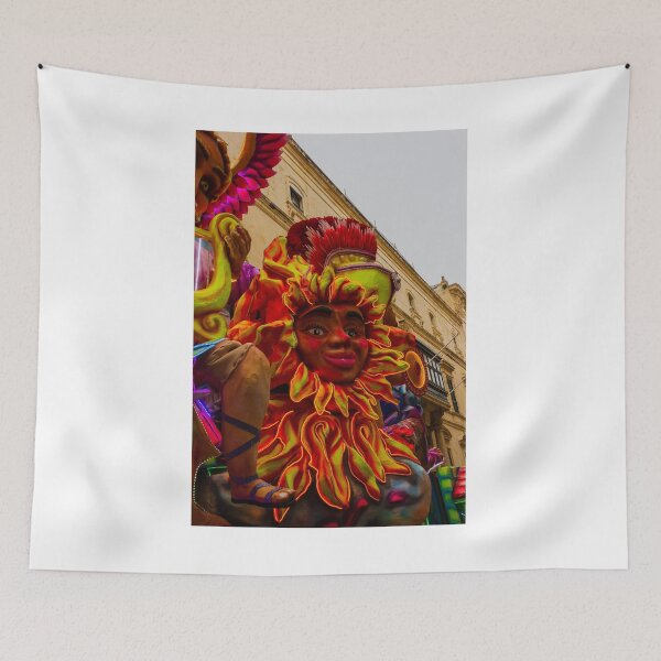 Item preview, Colorful Carnival Parade Float With Sun Face Sculpture Amid Historic Street Celebration designed and sold by Nmallia.