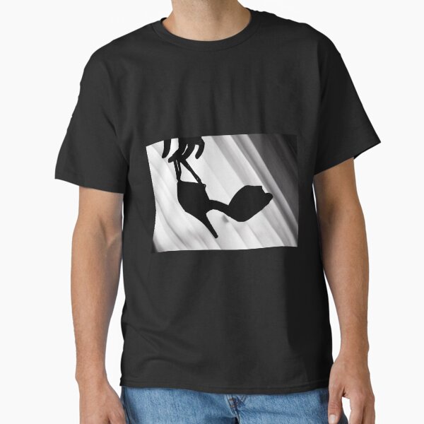 Silhouette of hand holding dance shoe Classic T-Shirt