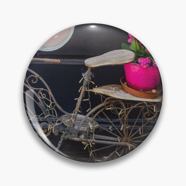 Item preview, Vintage Decorative Bicycle Planter With Bright Pink Flowers Against Dark Wall Street Display designed and sold by Nmallia.