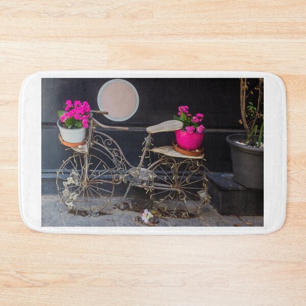 Item preview, Vintage Decorative Bicycle Planter With Bright Pink Flowers Against Dark Wall Street Display designed and sold by Nmallia.
