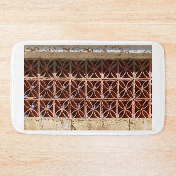 Item preview, Terracotta Ventilation Blocks Forming Decorative Geometric Wall Pattern On Weathered Building designed and sold by Nmallia.