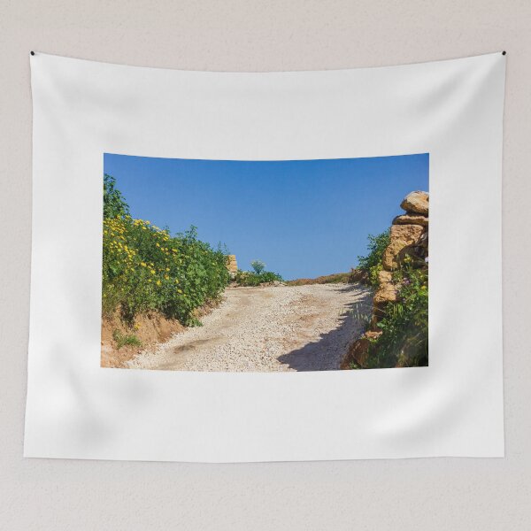 Item preview, Sunny Rural Gravel Road Lined With Yellow Wildflowers And Stone Walls Under Clear Blue Sky designed and sold by Nmallia.