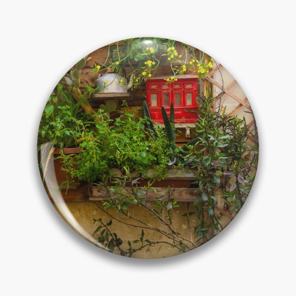 Item preview, Lush Vertical Garden With Yellow Flowers, Potted Plants And Rustic Window Trellis On Stone Wall designed and sold by Nmallia.