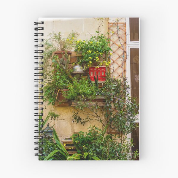Item preview, Lush Vertical Garden With Yellow Flowers, Potted Plants And Rustic Window Trellis On Stone Wall designed and sold by Nmallia.