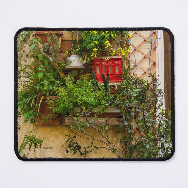 Item preview, Lush Vertical Garden With Yellow Flowers, Potted Plants And Rustic Window Trellis On Stone Wall designed and sold by Nmallia.