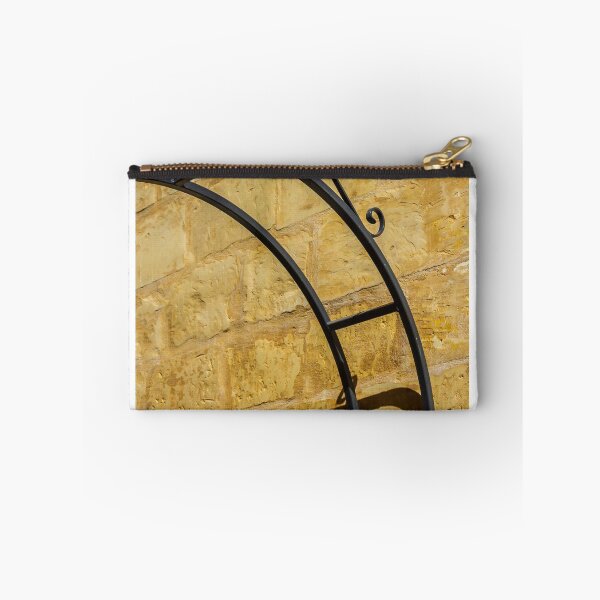 Item preview, Decorative Wrought Iron Arch Casting Shadow On Sunlit Sandstone Wall Architectural Detail designed and sold by Nmallia.