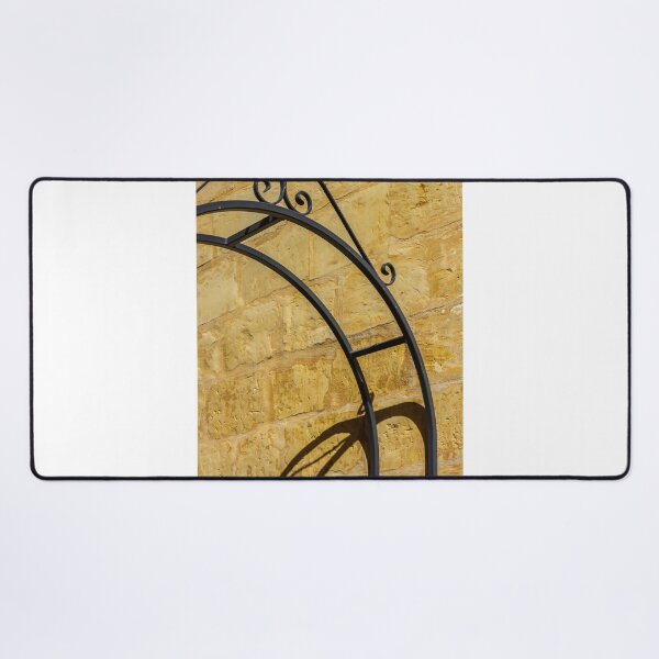 Item preview, Decorative Wrought Iron Arch Casting Shadow On Sunlit Sandstone Wall Architectural Detail designed and sold by Nmallia.