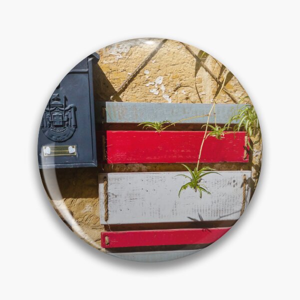 Item preview, Rustic Black Mailbox On Sunlit Stone Wall With Red And White Wooden Panels And Potted Plant designed and sold by Nmallia.