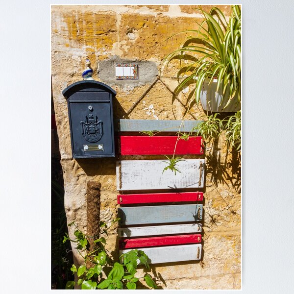 Item preview, Rustic Black Mailbox On Sunlit Stone Wall With Red And White Wooden Panels And Potted Plant designed and sold by Nmallia.