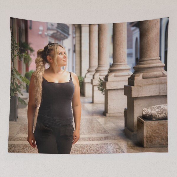 Item preview, Woman walking under historic arcade in Verona, Italy designed and sold by RastislavS.