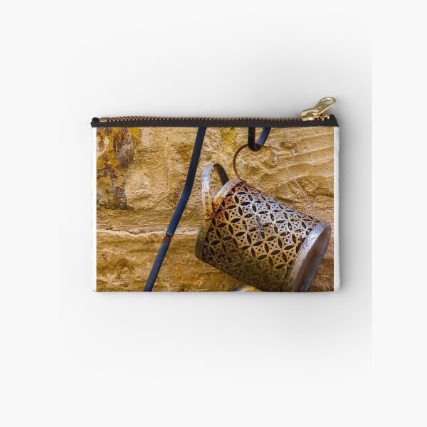 Item preview, Rusty Decorative Watering Can Hanging On Textured Yellow Stone Wall With Vintage Charm designed and sold by Nmallia.
