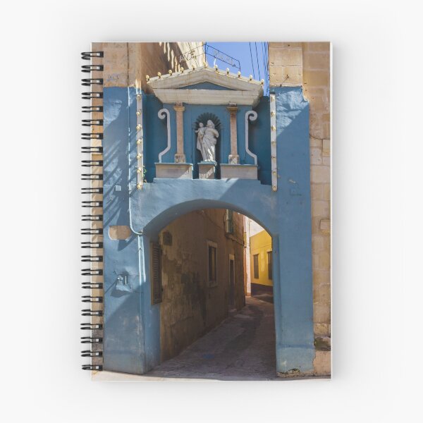 Item preview, Blue Archway With Marian Statue Over Narrow Mediterranean Alleyway in Historic Town designed and sold by Nmallia.