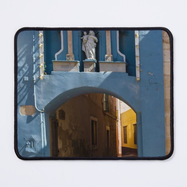 Item preview, Blue Archway With Marian Statue Over Narrow Mediterranean Alleyway in Historic Town designed and sold by Nmallia.