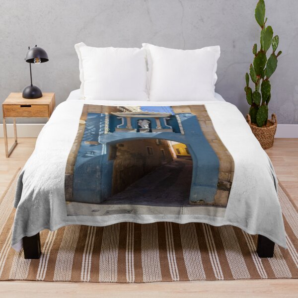 Item preview, Blue Archway With Marian Statue Over Narrow Mediterranean Alleyway in Historic Town designed and sold by Nmallia.