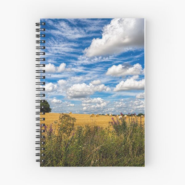 Item preview, British Countryside Harvest: Golden Wheat Field with Straw Bales and Dramatic Blue Sky designed and sold by Astute-Artio-Photography.