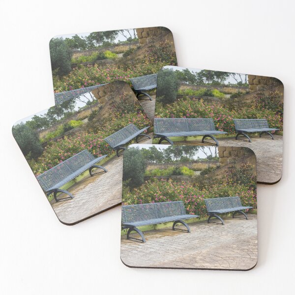 Item preview, Empty Metal Benches in Flower Garden Next to Stone Wall in Outdoor Park designed and sold by Nmallia.