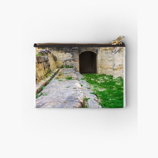 Item preview, Ancient Stone Tunnel Entrance and Weathered Ruins With Green Grass and Mossy Pathway designed and sold by Nmallia.