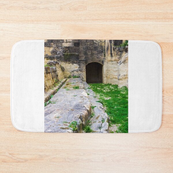 Item preview, Ancient Stone Tunnel Entrance and Weathered Ruins With Green Grass and Mossy Pathway designed and sold by Nmallia.