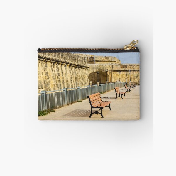 Item preview, Row Of Wooden Benches Along Historic Stone Fort Promenade On Sunny Empty Walkway designed and sold by Nmallia.