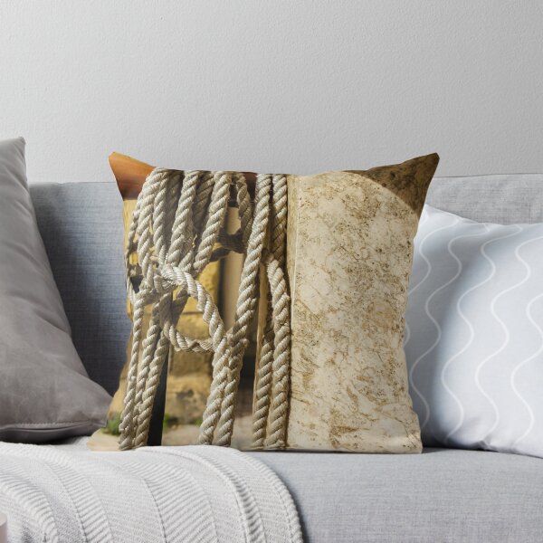 Item preview, Coiled Rope Hanging on Stone Railing Beside Marble Wall with Sunlit Texture and Shadows designed and sold by Nmallia.