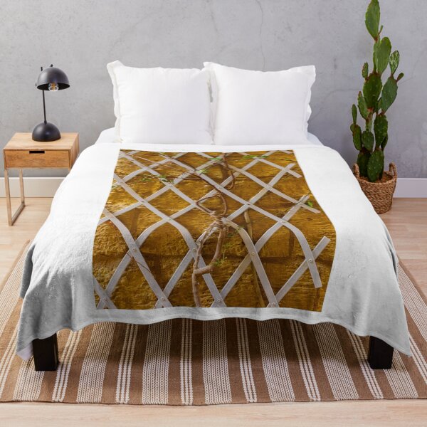 Item preview, Climbing Vine on White Trellis Against Textured Yellow Brick Wall Rustic Garden Background designed and sold by Nmallia.