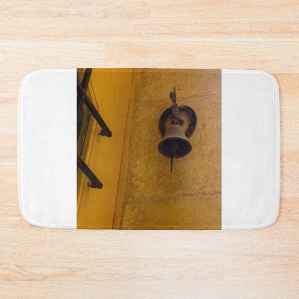 Item preview, Rustic Door Bell and Horseshoe Mounted on Sunlit Yellow Stone Wall in Mediterranean Alley designed and sold by Nmallia.