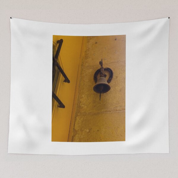Item preview, Rustic Door Bell and Horseshoe Mounted on Sunlit Yellow Stone Wall in Mediterranean Alley designed and sold by Nmallia.
