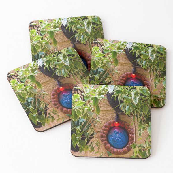 Item preview, Blue Religious Wall Medallion With Red Light Nestled Among Green Garden Foliage On Stone designed and sold by Nmallia.