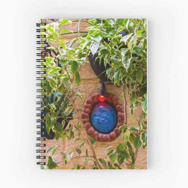 Item preview, Blue Religious Wall Medallion With Red Light Nestled Among Green Garden Foliage On Stone designed and sold by Nmallia.